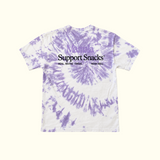 Mamala Organics’ Mamala x La Bananita Tee: purple/white tie-dye, black text, “Support Snacks,” made in LA.