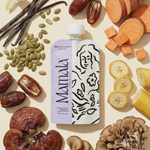 A Mamamellow Support Snack™ pouch with dates, bananas, mushrooms, sweet potato, pumpkin seeds, and vanilla beans.